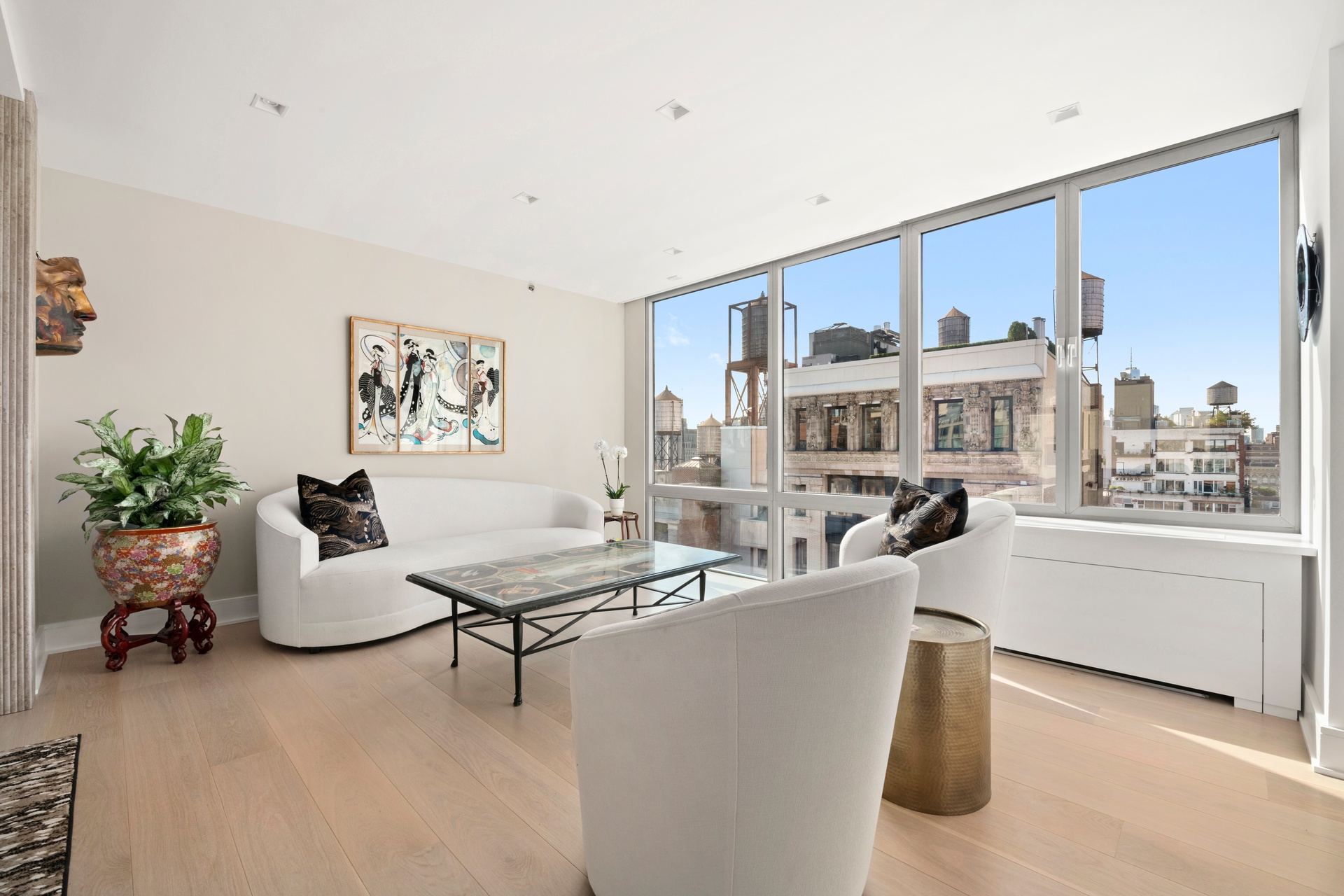 151 West 17th Street, Unit PHF-FURN Manhattan, NY 10011 - Photo 3 of 19 a living room with furniture and flowers