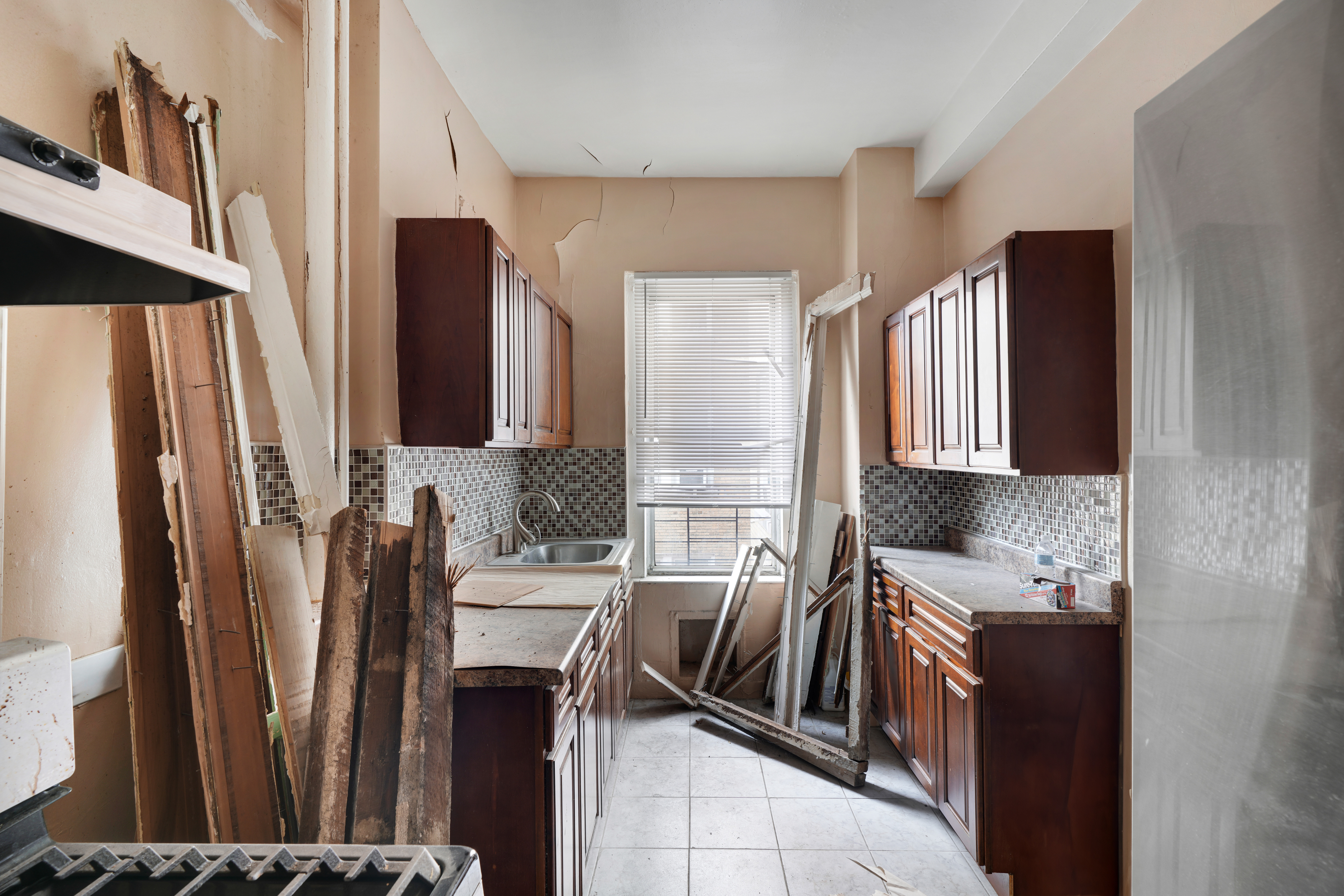 416 Ocean Avenue, Unit 62 Brooklyn, NY 11226 - Photo 3 of 22 a kitchen with stainless steel appliances a refrigerator and a stove
