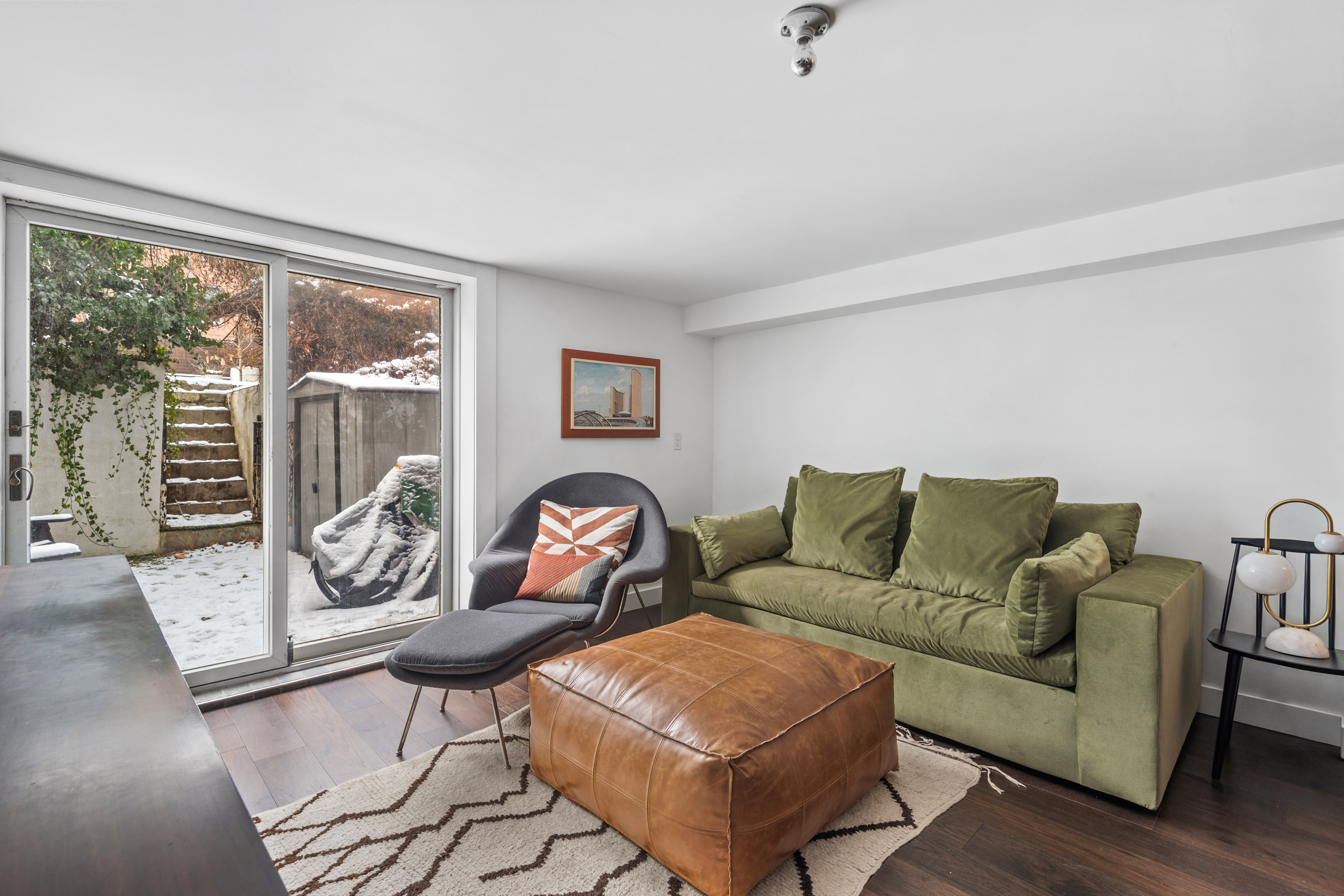 110 North 9th Street, Unit TH1 Brooklyn, NY 11249 - Photo 2 of 14 a living room with furniture and a floor to ceiling window