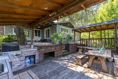 a living room filled with furniture and a fireplace