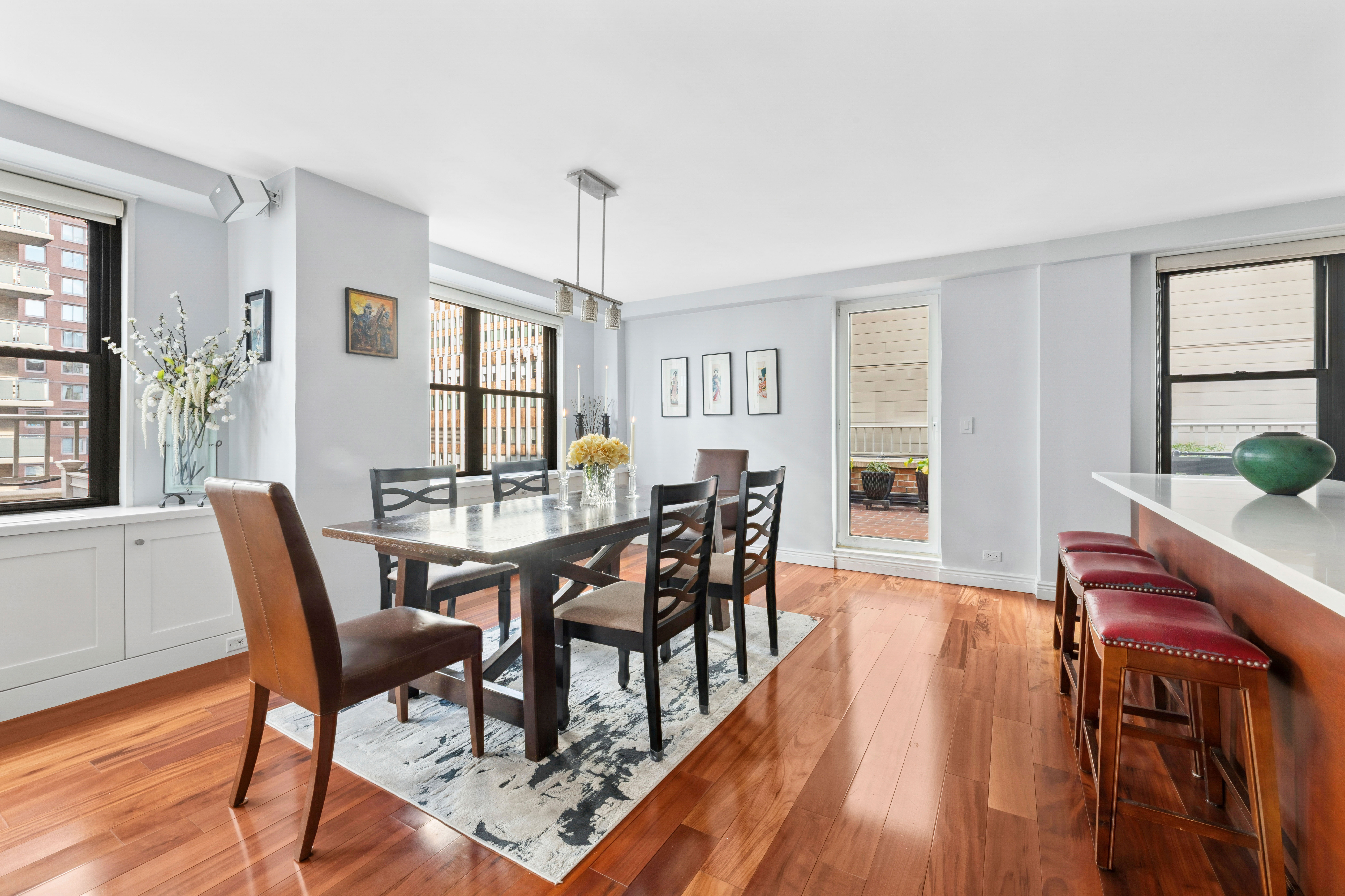 305 East 40th Street, Unit 19CD Manhattan, NY 10016 - Photo 3 of 16 a view of a dining room with furniture window and wooden floor