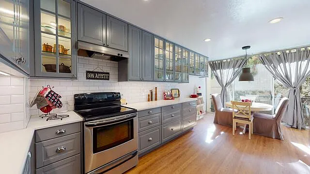 455 Grant Avenue, Unit 4 Palo Alto, CA 94306 - Photo 1 of 1 a kitchen with stainless steel appliances a stove a sink and a refrigerator