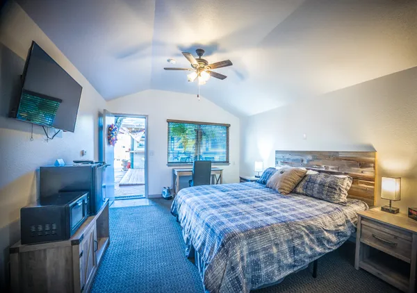 a living room with a floor to ceiling window and couch