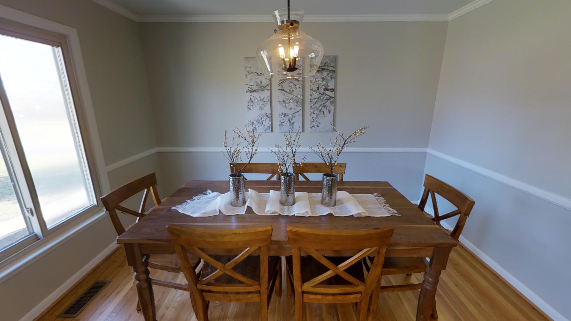 4425 Prescott Road Nashville, TN 37204 - Photo 5 of 26 a view of a dining room with furniture a chandelier and wooden floor