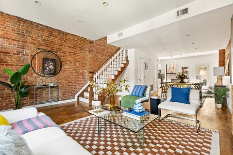 a living room with furniture and a rug