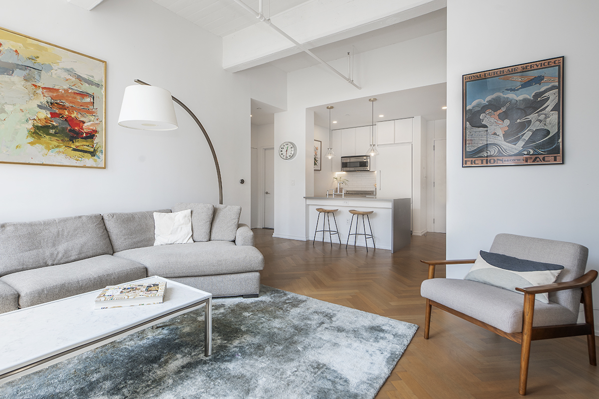 a living room with furniture and a rug
