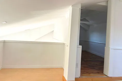 a view of a house with a snow in a yard