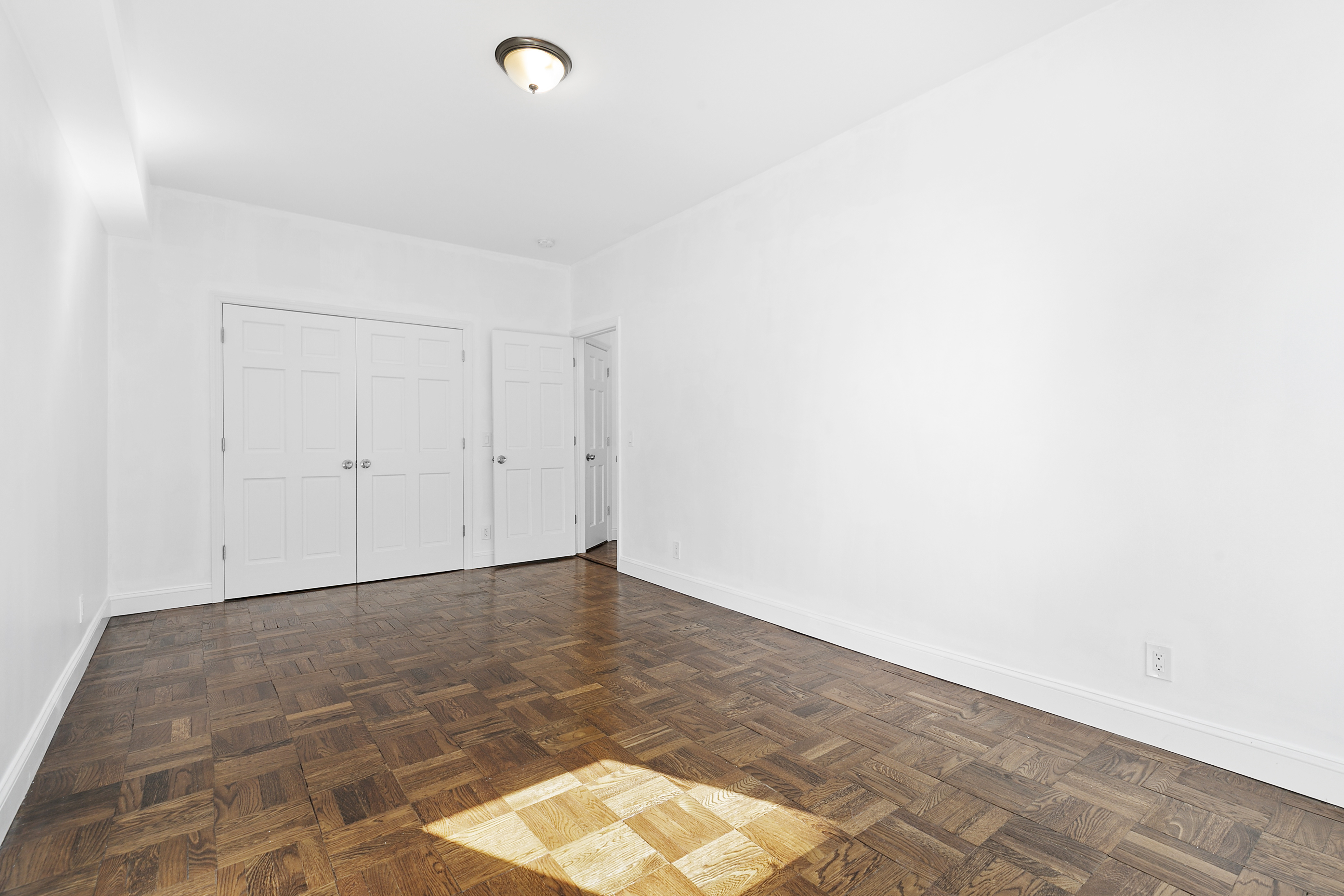 159-34 Riverside Drive West, Unit 1J90 Manhattan, NY 10032 - Photo 9 of 19 a view of an empty room