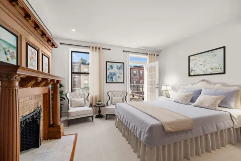 a bedroom with a bed and a couch