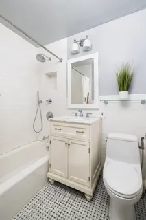 a bathroom with a sink a toilet and a bathtub