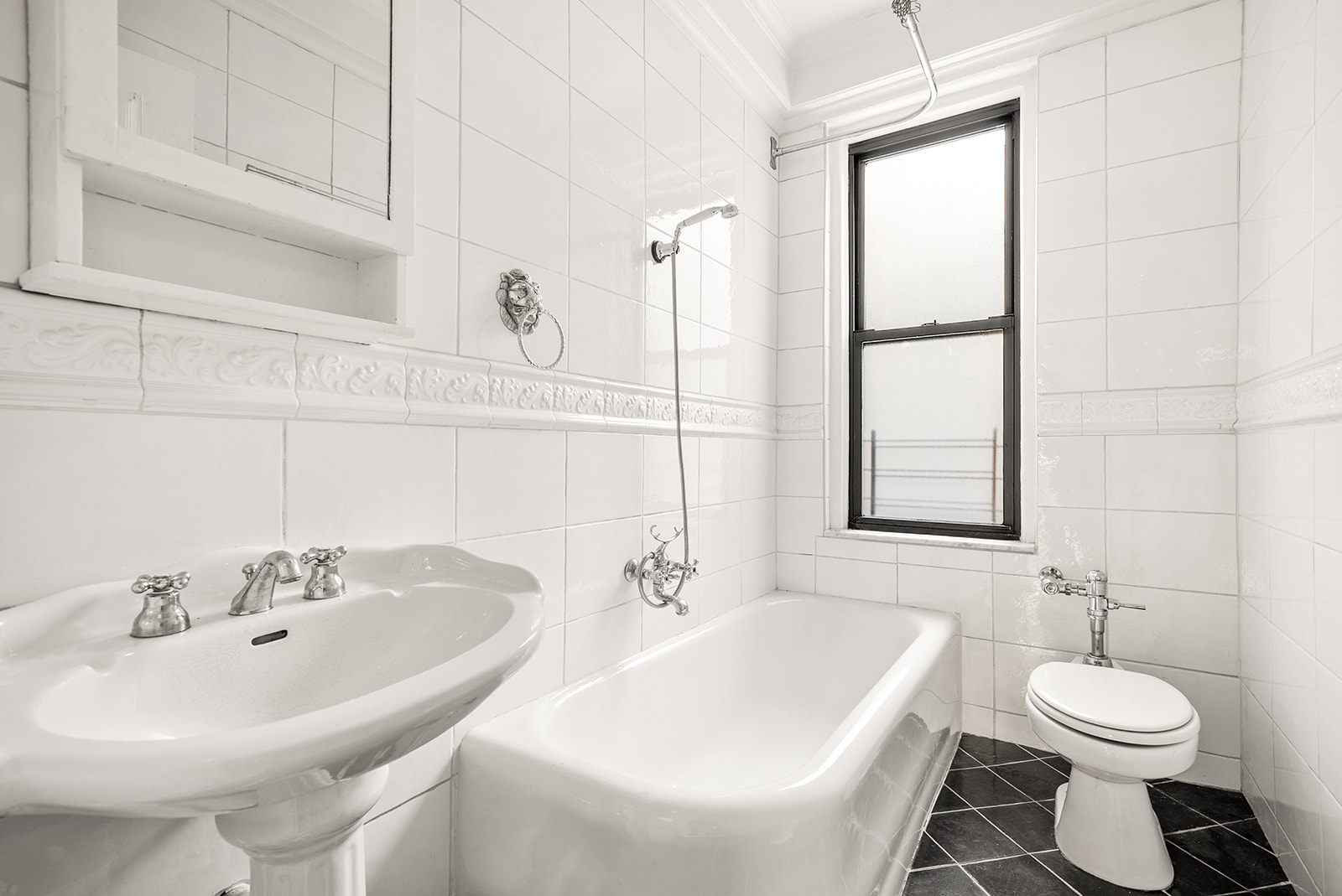 152 West 58th Street, Unit 6CD Manhattan, NY 10019 - Photo 8 of 9 a bathroom with a sink and a toilet
