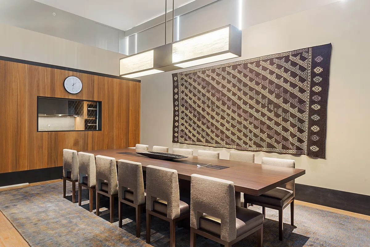 101 Warren Street, Unit 840 Manhattan, NY 10007 - Photo 14 of 16 a view of a chairs and table in a room