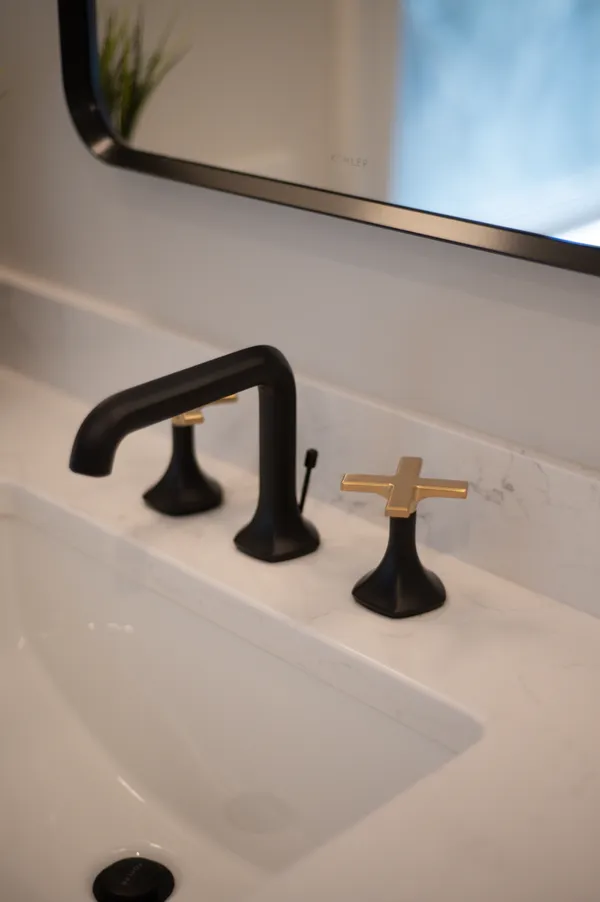 a view of a livingroom with wooden floor and stairs
