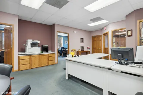 a kitchen with stainless steel appliances kitchen island granite countertop a sink and counter space