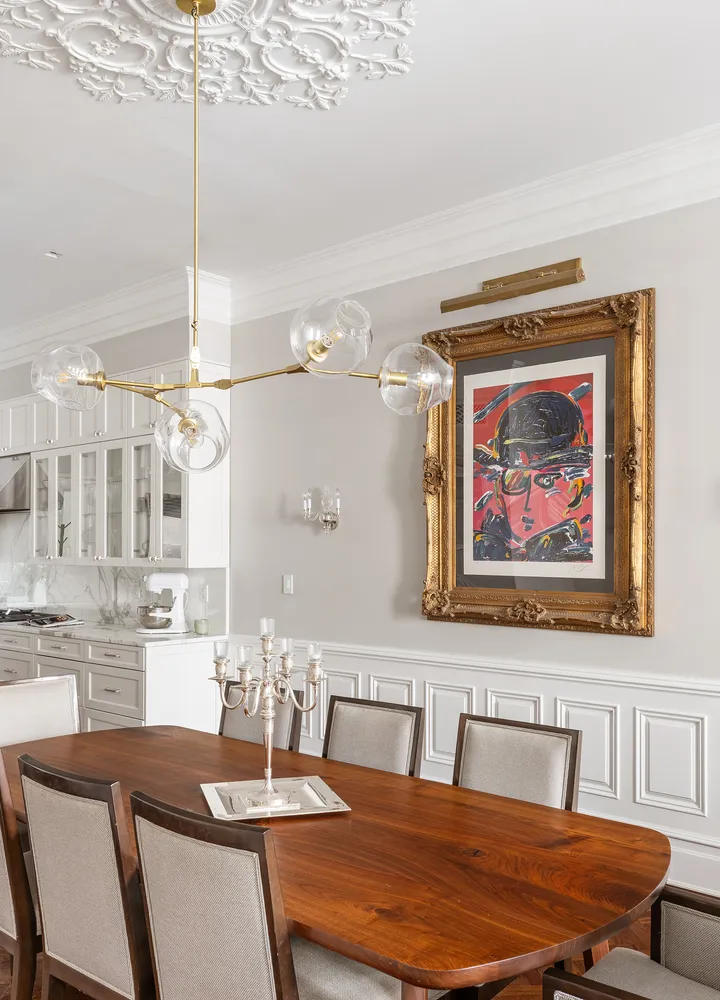 a dining room with a table and chairs