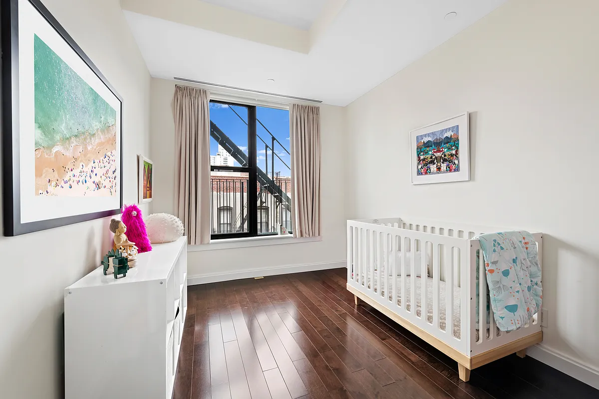 320 West 115th Street, Unit 4 Manhattan, NY 10026 - Photo 7 of 12 a living room with furniture and wooden floor