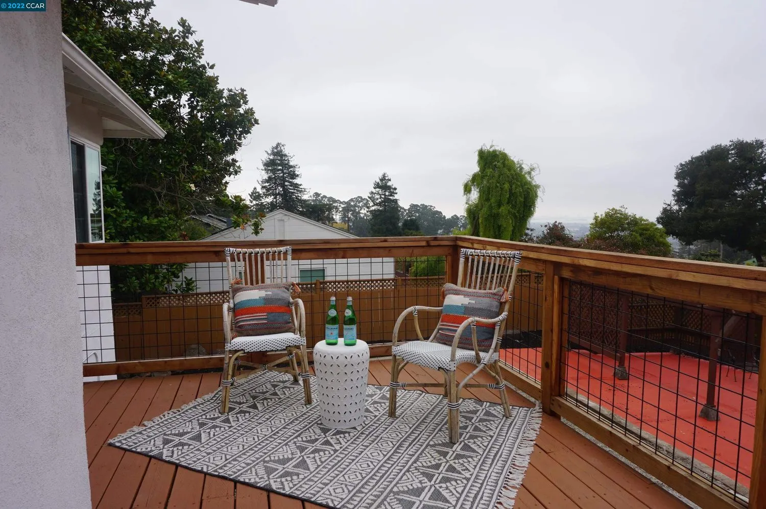 a view of sitting area with furniture on wooden deck
