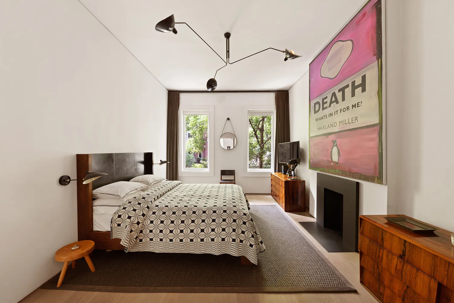 a bedroom with a bed and a fireplace