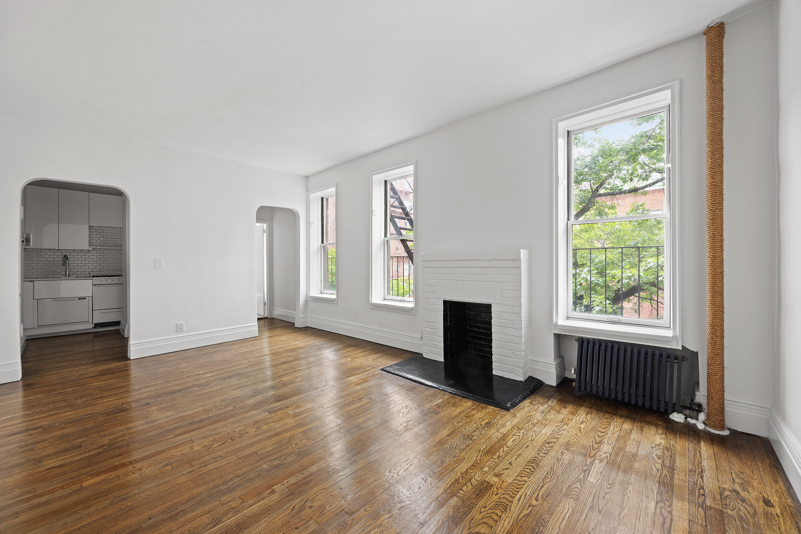 10 Bethune Street, Unit 2B Manhattan, NY 10014 - Photo 4 of 7 wooden floor in an empty room with a window