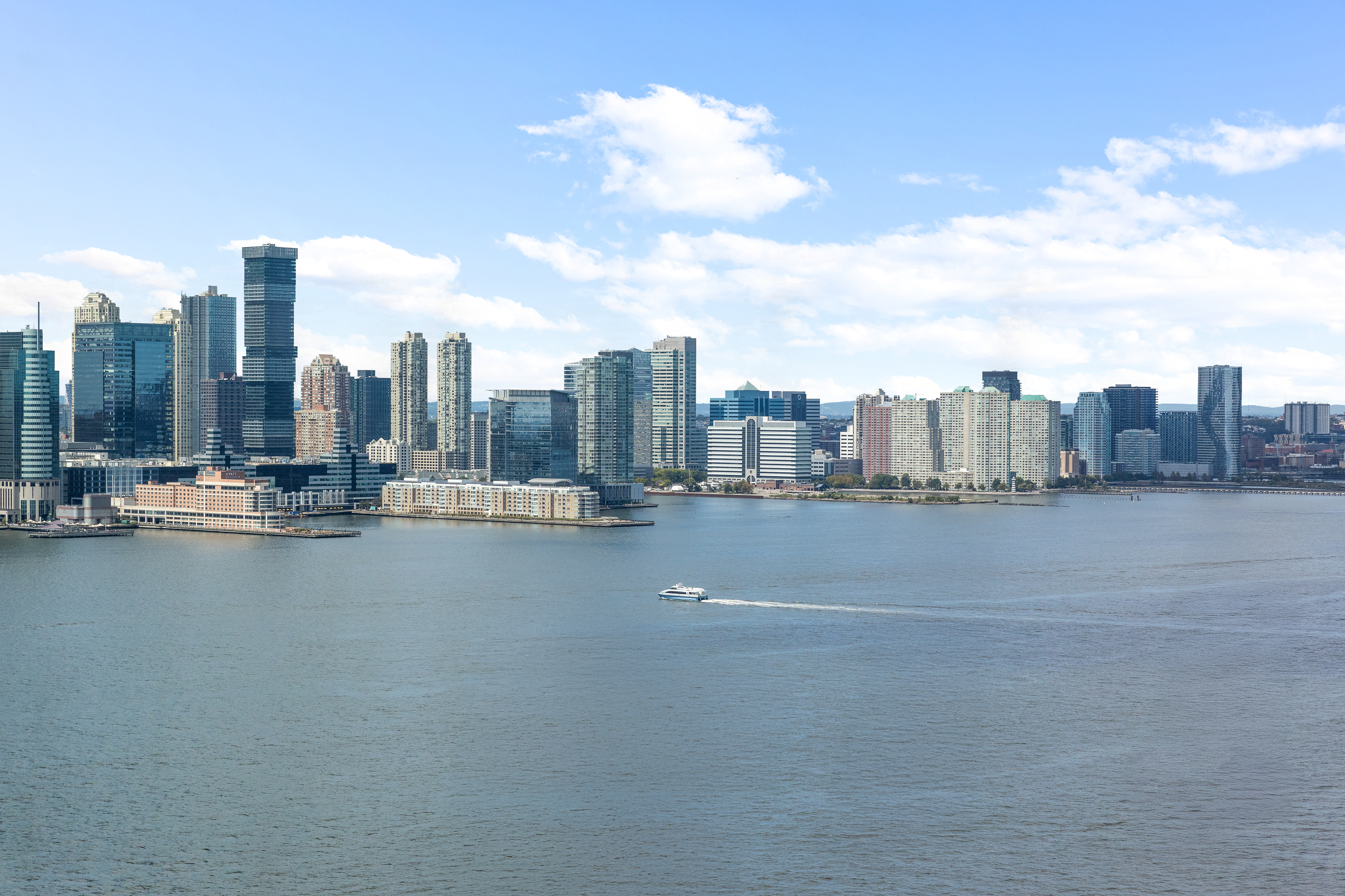 10 West Street, Unit 27B Manhattan, NY 10004 - Photo 7 of 8 a view of a city with tall buildings