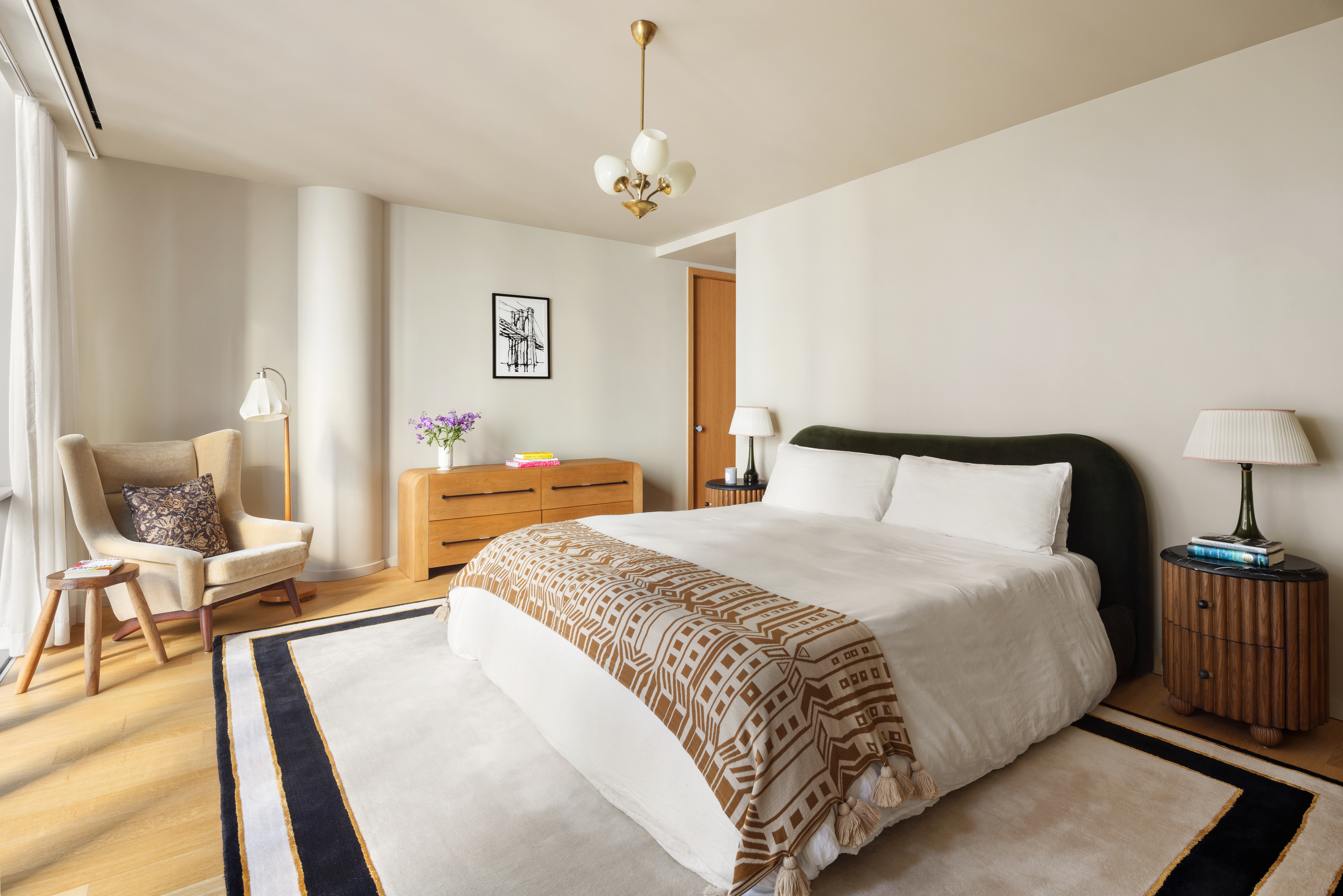 565 Broome Street, Unit N12E Manhattan, NY 10013 - Photo 5 of 19 a spacious bedroom with a bed and chair