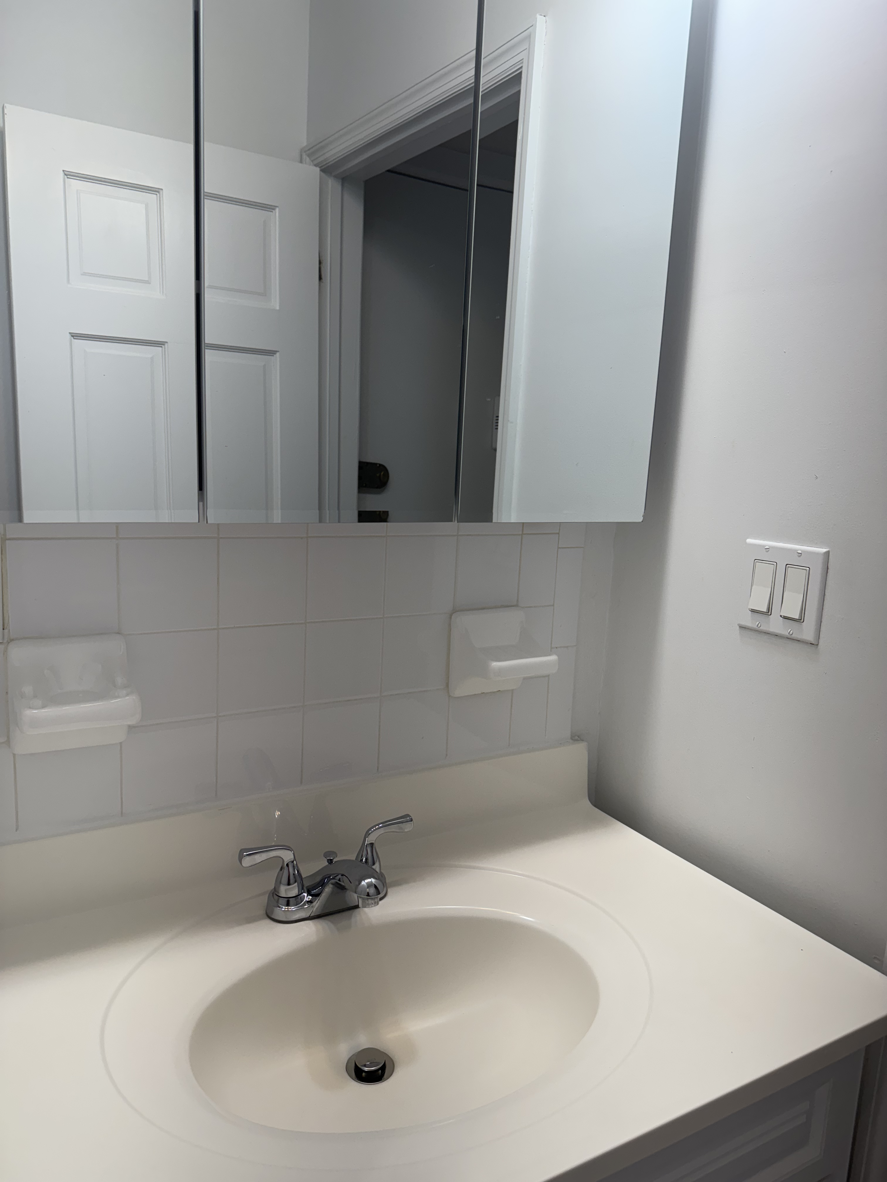260 Cumberland Street, Unit 15 Brooklyn, NY 11205 - Photo 7 of 10 a bathroom with a sink and a mirror