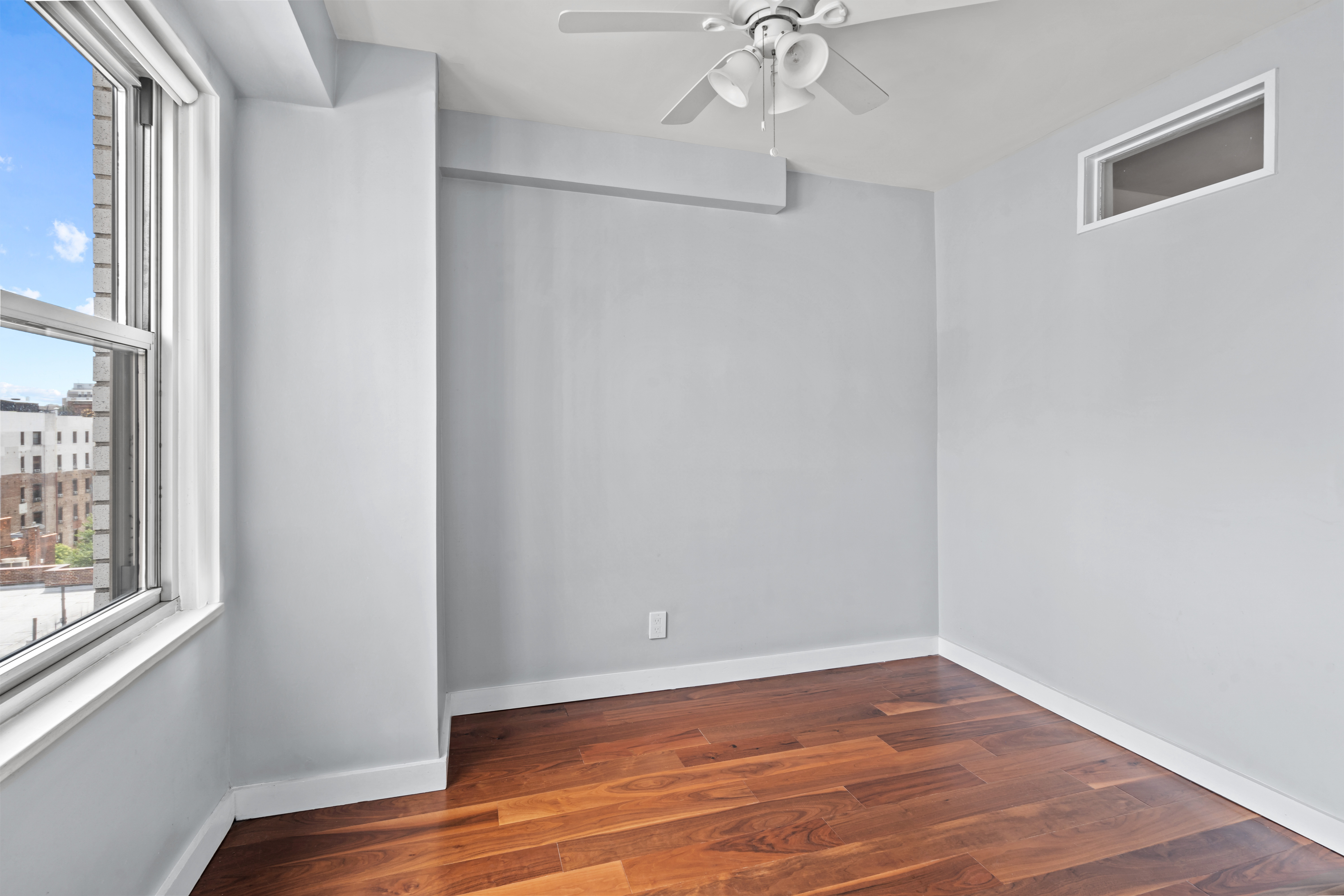 205 3rd Avenue, Unit 11T Manhattan, NY 10003 - Photo 12 of 20 a view of a room with wooden floor and fan