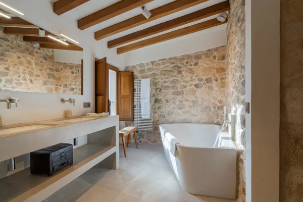 a en suite bathroom with a sink and a mirror