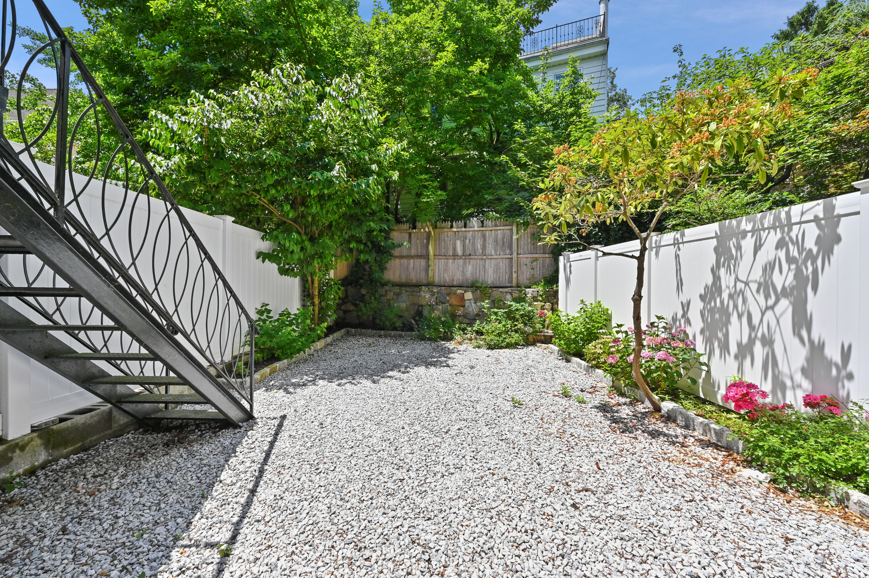 5823 Fieldston Road, Unit 1A Bronx, NY 10471 - Photo 24 of 26 a view of small garden with wooden fence