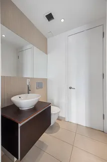 a room with a sink and a mirror