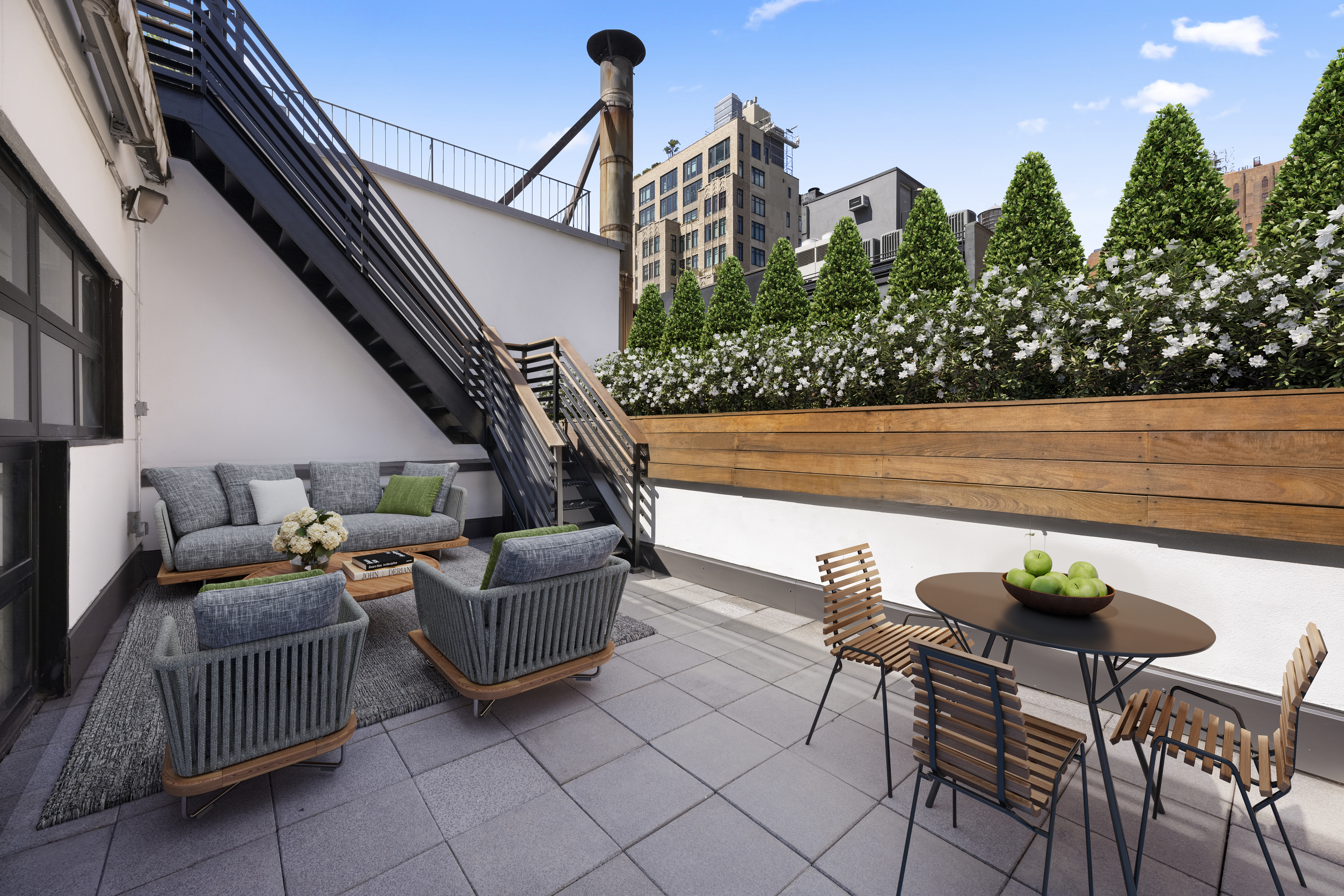 74 Warren Street, Unit 5W Manhattan, NY 10007 - Photo 2 of 15 a balcony with outdoor seating and plants