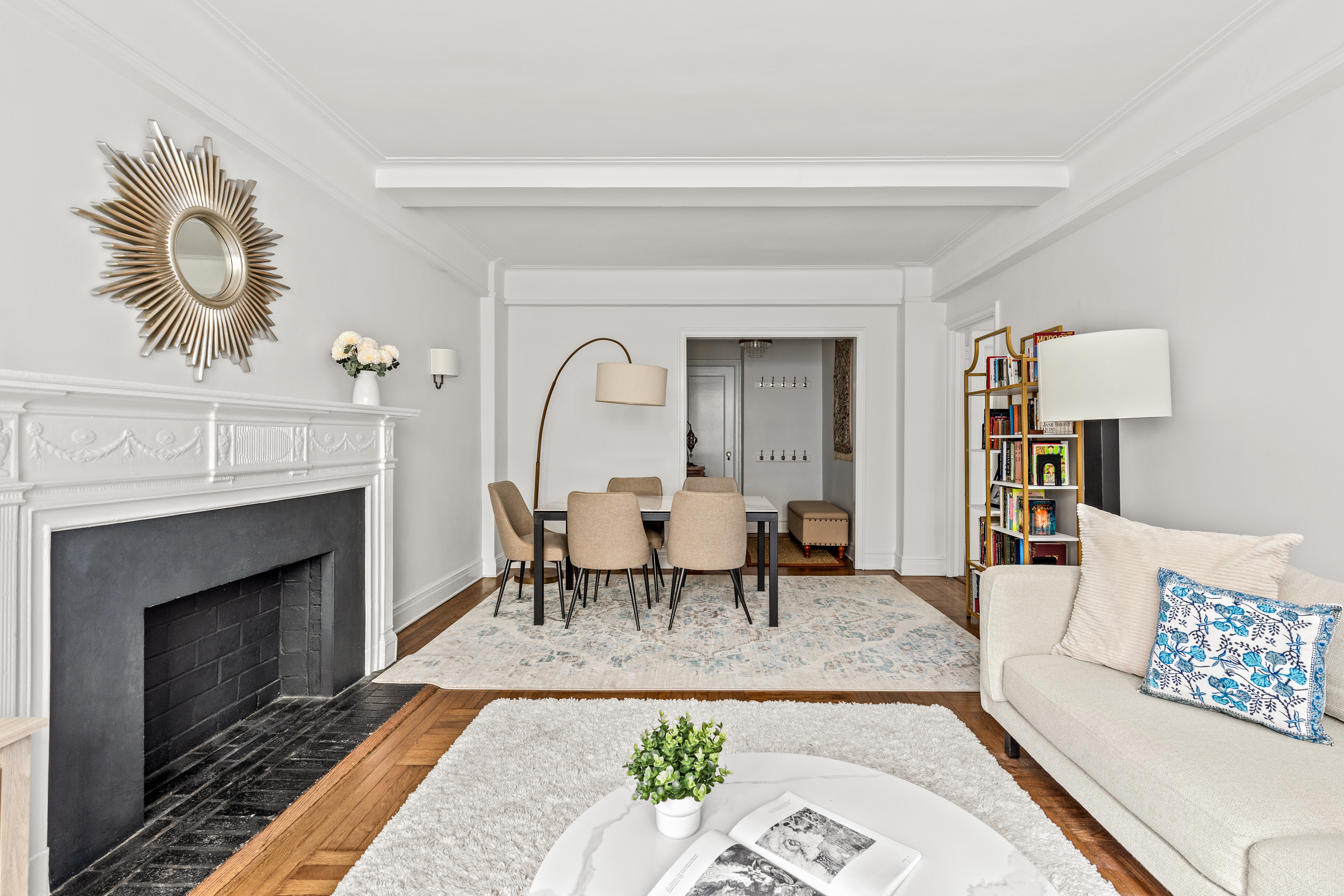 70 East 96th Street, Unit 2D Manhattan, NY 10128 - Photo 3 of 14 a living room with furniture and a fireplace