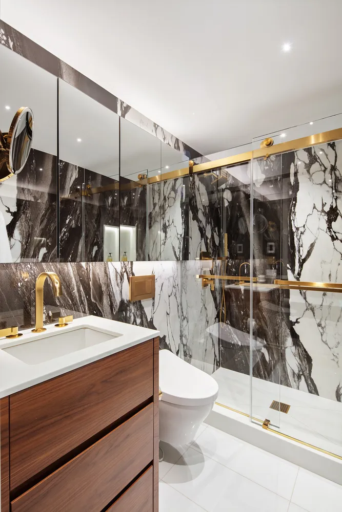 a view of a livingroom with workspace and a window