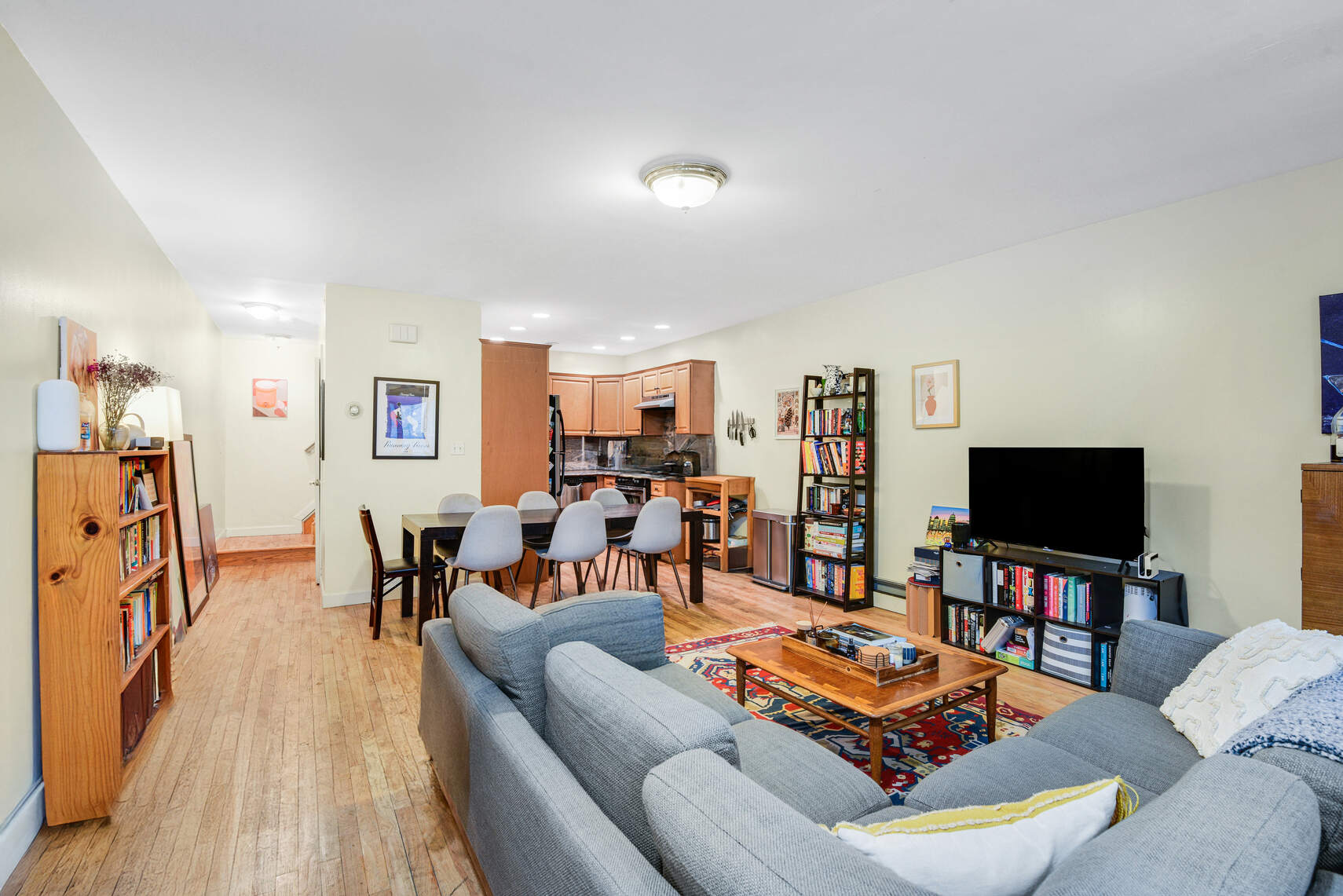 585 Warren Street, Unit 2 Brooklyn, NY 11217 - Photo 2 of 12 a living room with furniture and a flat screen tv