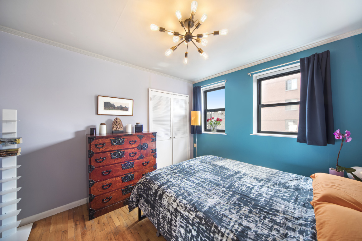 319 East 105th Street, Unit 5A Manhattan, NY 10029 - Photo 5 of 13 a bedroom with a bed and a window