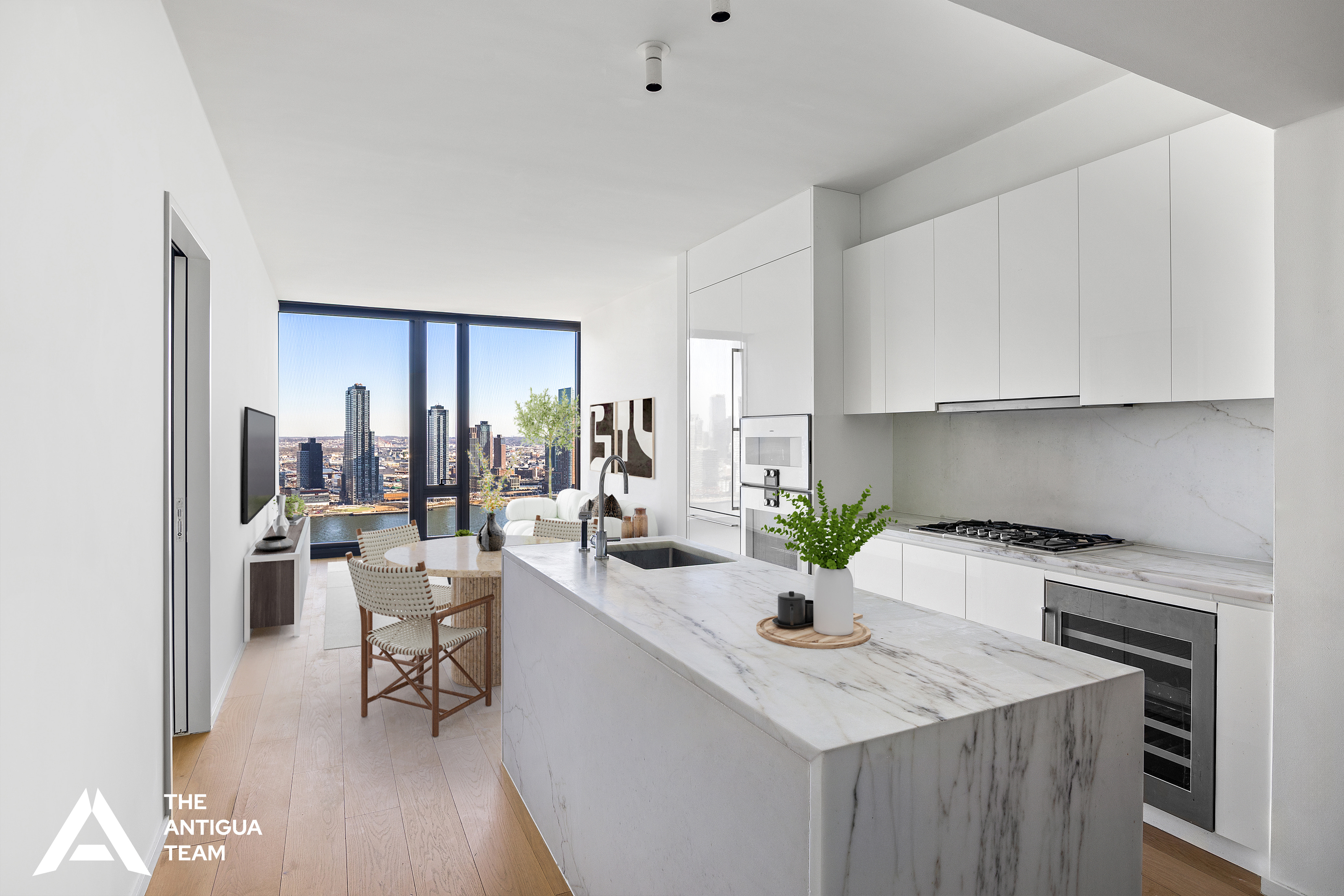 695 1st Avenue, Unit 34A Manhattan, NY 10016 - Photo 2 of 21 a kitchen with a sink a stove and chairs