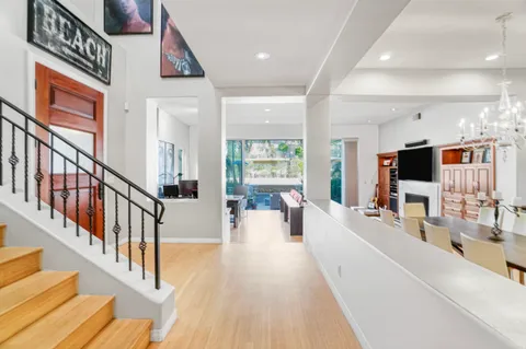 a view of a living room and a flat screen tv