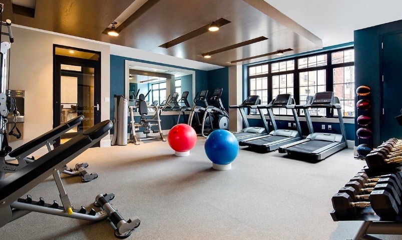 42 Maspeth Avenue, Unit 1B Brooklyn, NY 11211 - Photo 7 of 12 a room with gym equipment and a large window