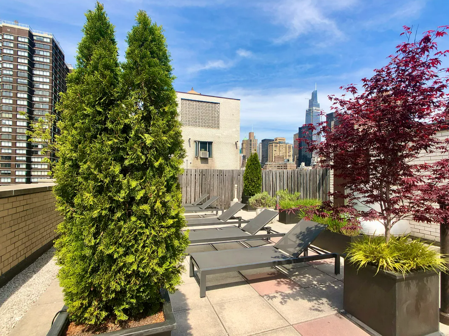 333 East 34th Street, Unit 5E Manhattan, NY 10016 - Photo 10 of 13 a view of a patio with table and chairs and potted plants