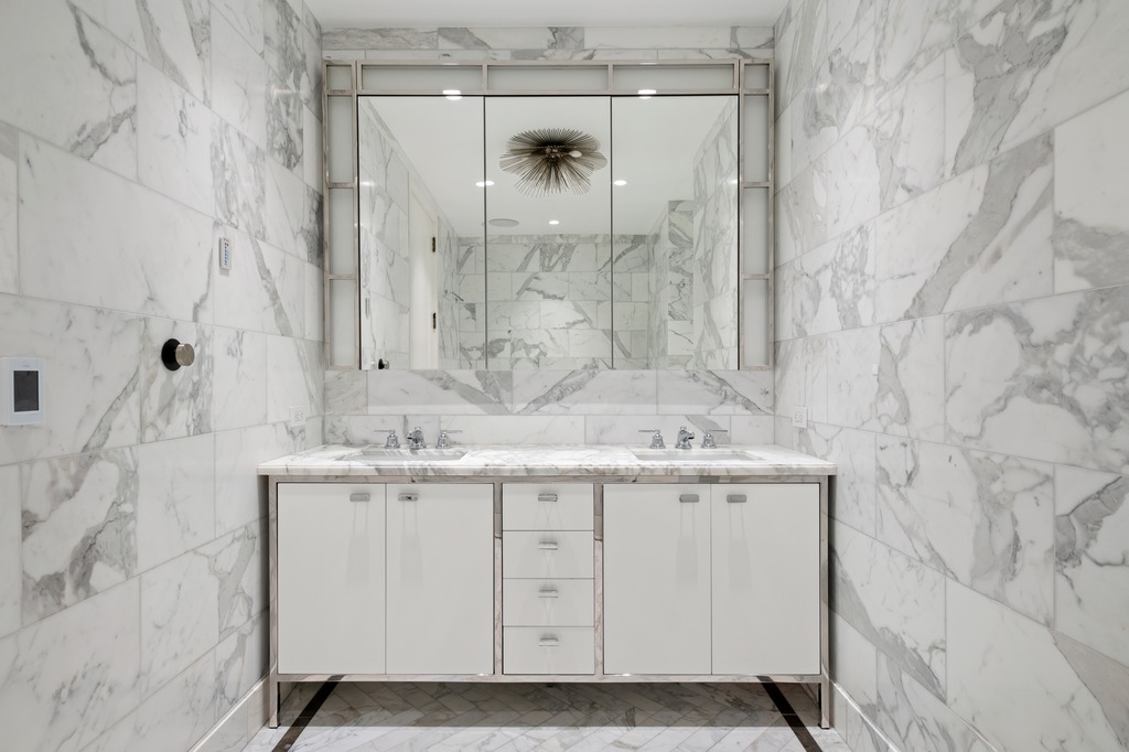 100 Barclay Street, Unit 21AD Manhattan, NY 10007 - Photo 15 of 40 a bathroom with a granite countertop sink a toilet and shower
