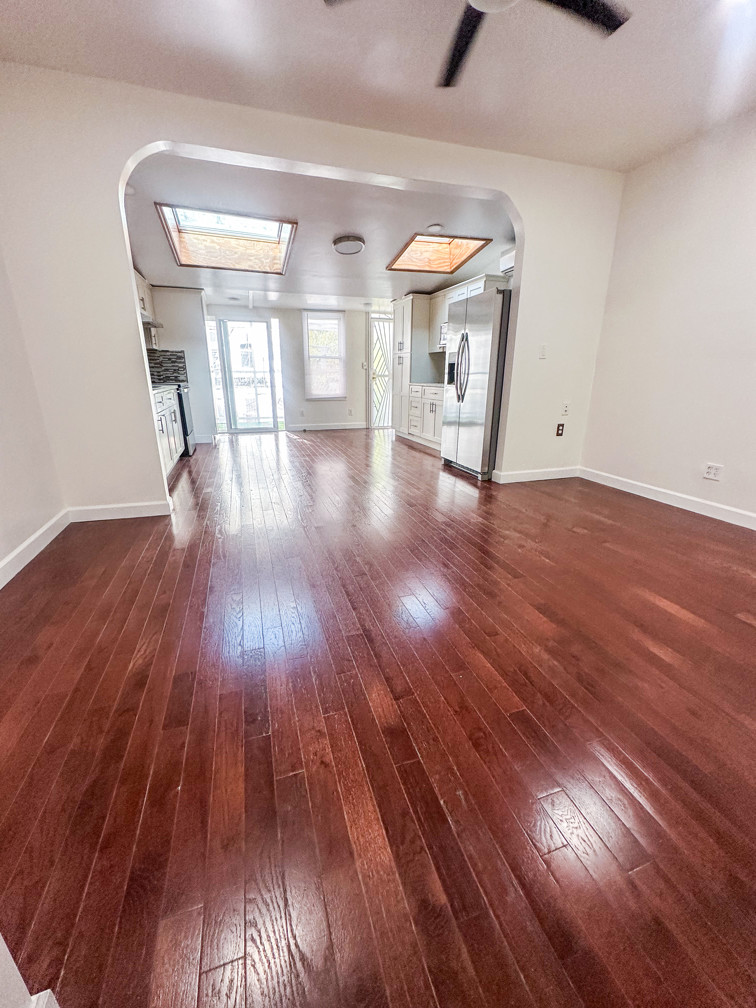 289 A Cooper Street, Unit 2 Brooklyn, NY 11237 - Photo 3 of 19 a view of empty room with a window and wooden floor