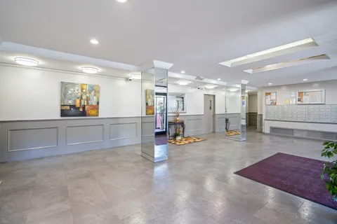 a view of a living room and kitchen