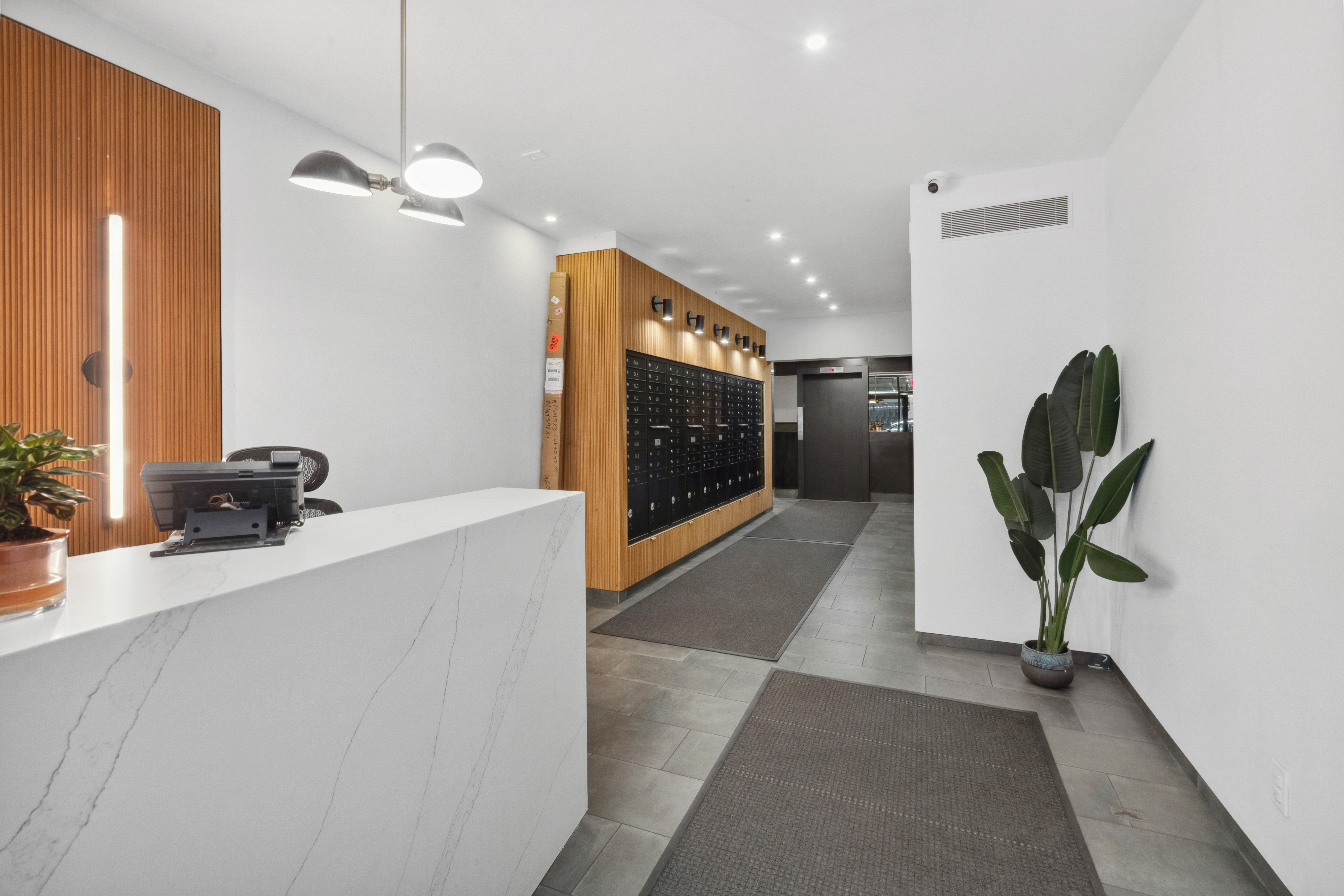 211 Thompson Street, Unit GLD Manhattan, NY 10012 - Photo 8 of 10 a view of a hallway with furniture and a chandelier