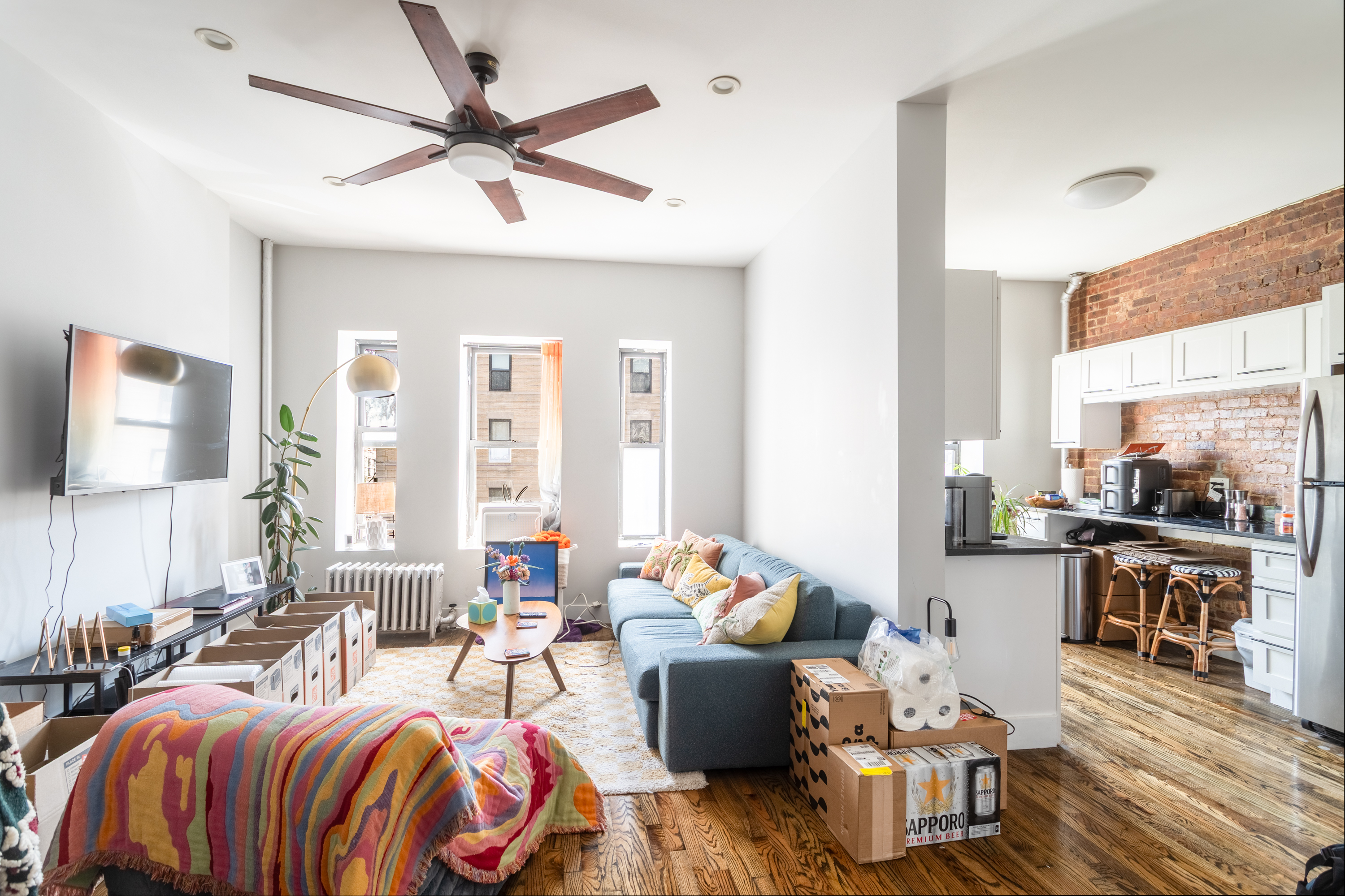 944 Marcy Avenue, Unit 3D Brooklyn, NY 11216 - Photo 1 of 9 a living room with furniture and a large window