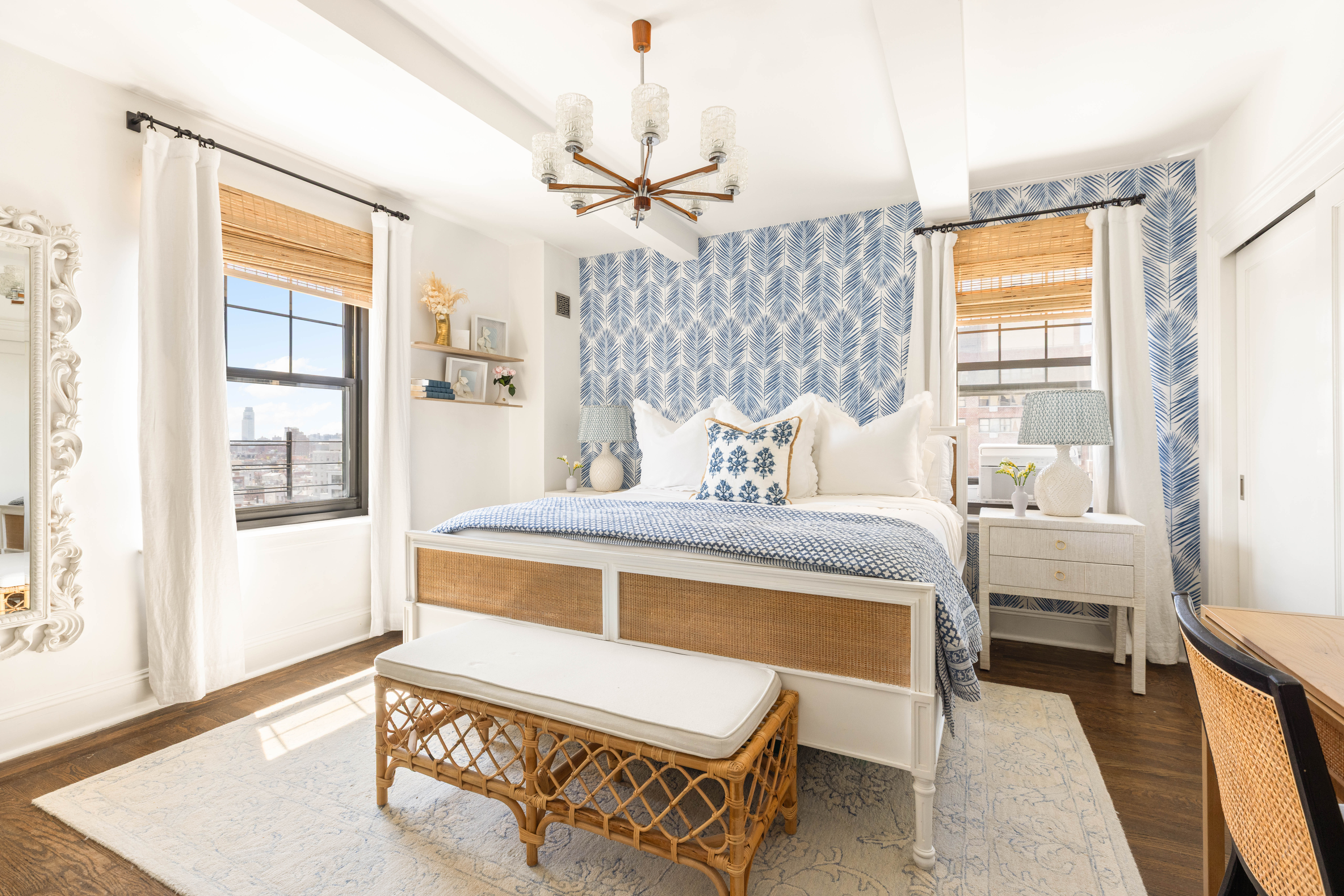 200 East 16th Street, Unit 14C Manhattan, NY 10003 - Photo 8 of 14 a bedroom with a bed and windows