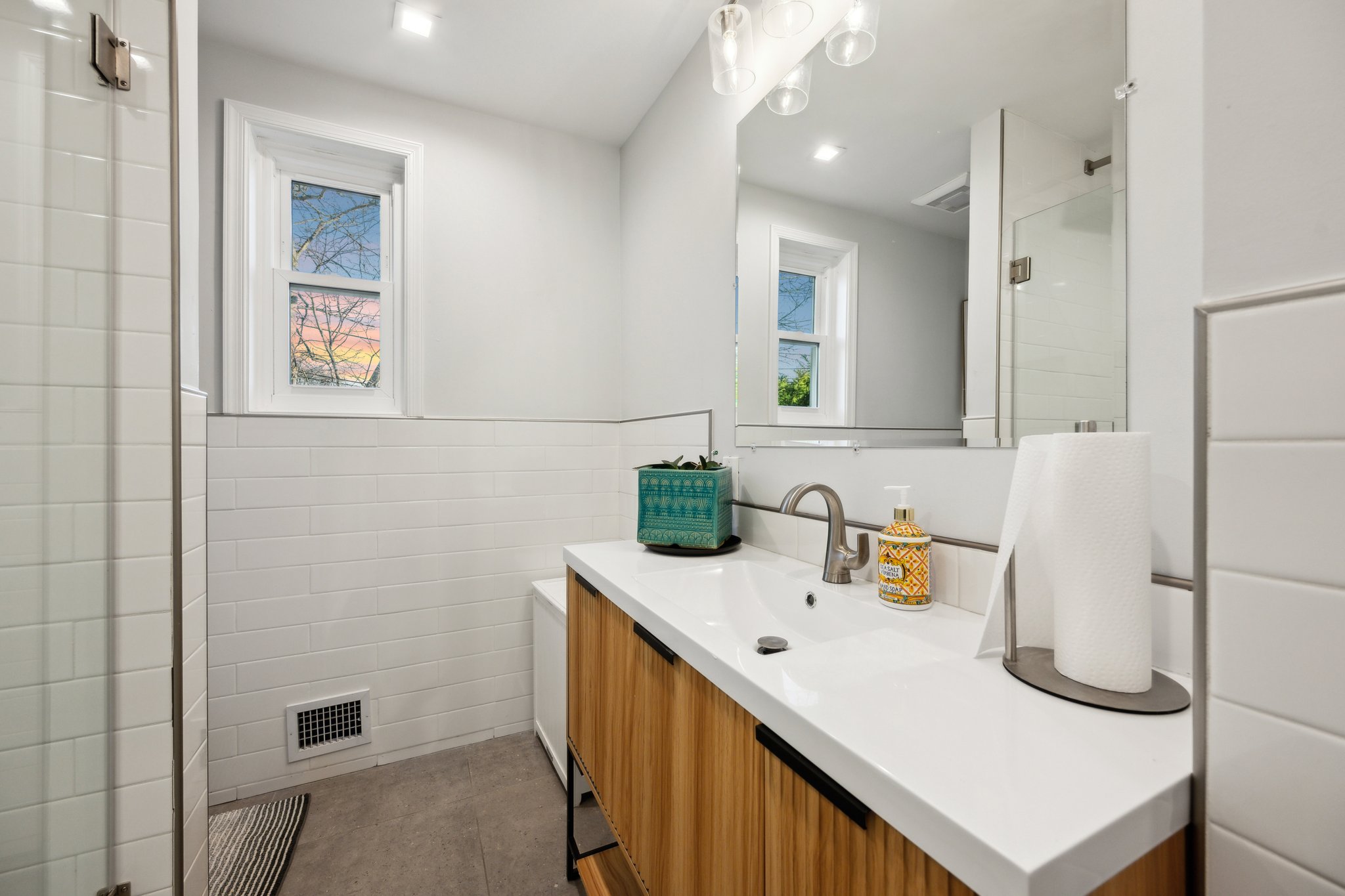 2607 Ross Road Chevy Chase, MD 20815 - Photo 13 of 37 a bathroom with a sink a toilet and mirror