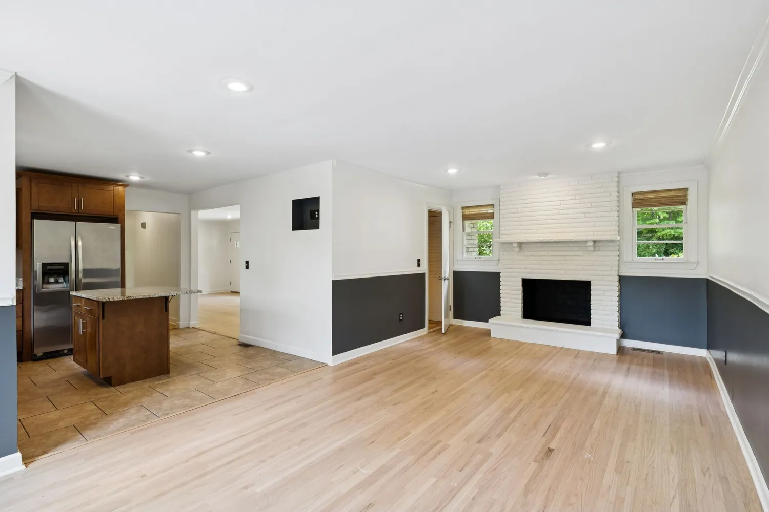 a view of kitchen with furniture and wooden floor