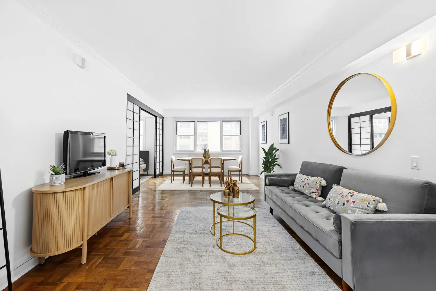 a living room with furniture and a flat screen tv