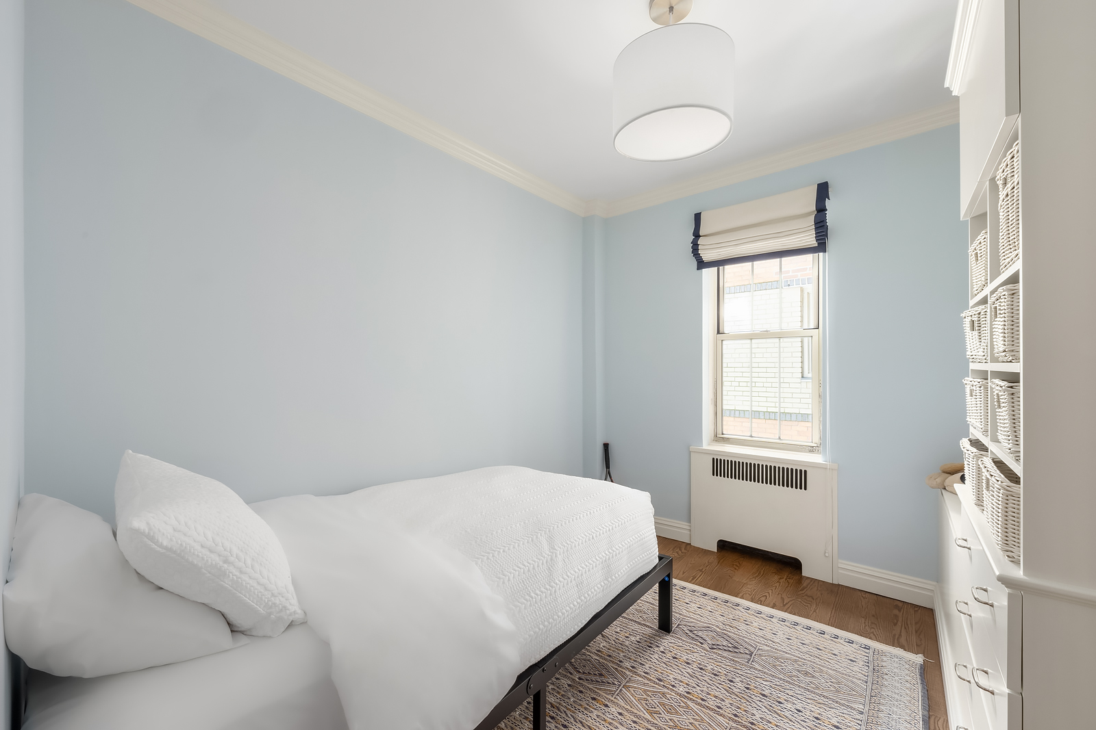 75 Bank Street, Unit 2H Manhattan, NY 10014 - Photo 12 of 18 a bedroom with a bed and window
