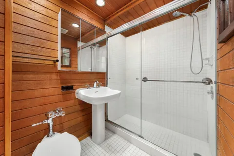 a bathroom with a sink and shower